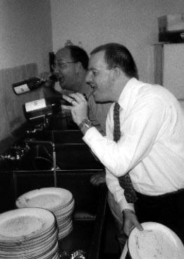 Dan and Grant enjoying themselves while rinsing dishes